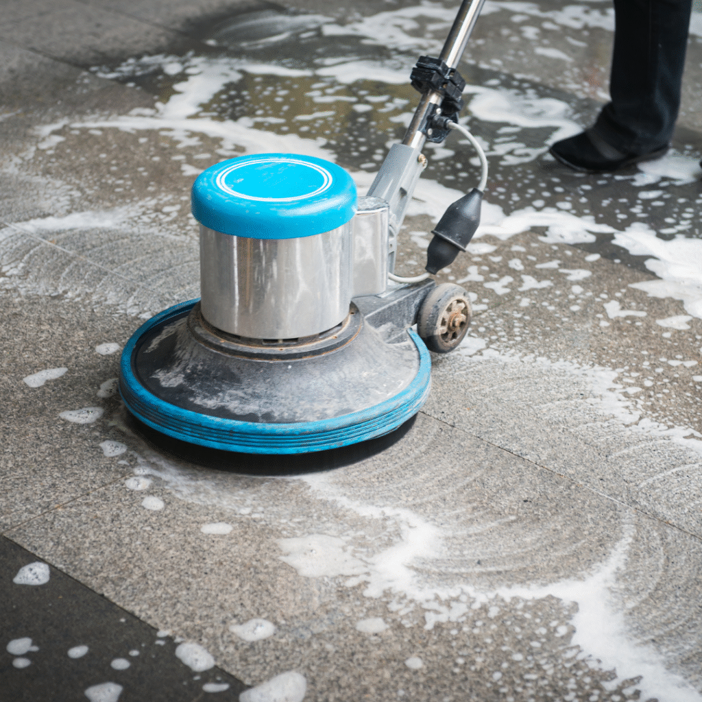 Cement cleaning service in Lakewood, CO – removing oil stains from driveway with power washing.”