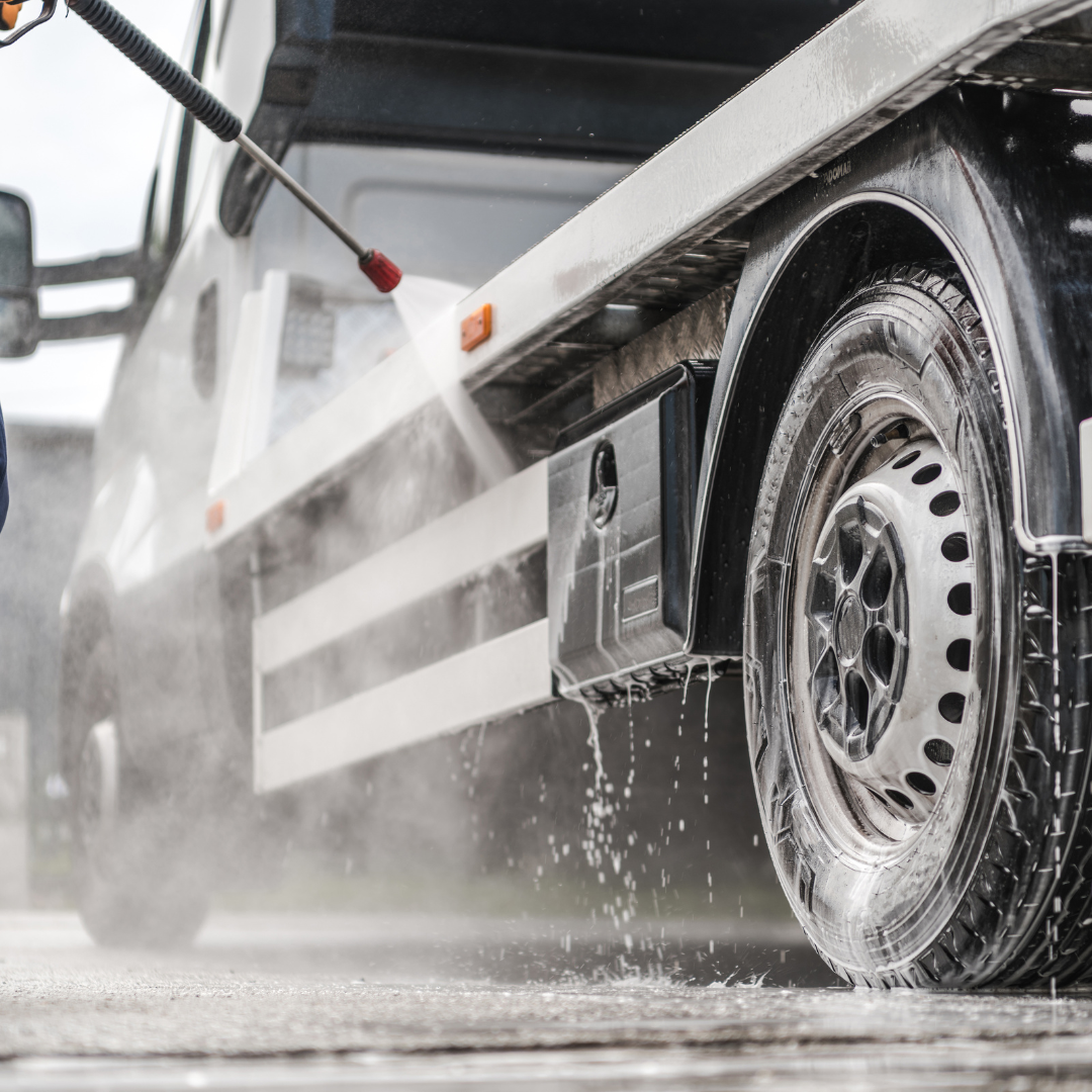 Fleet of delivery vans being pressure washed in Lakewood, CO